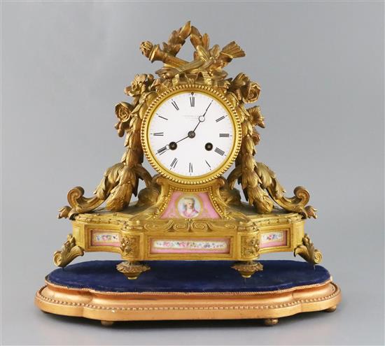 A.B. Savory & Sons of Cornhill. A late Victorian ormolu mantel clock, width 12.5in. depth 5in. height 12in., with associated giltwood p